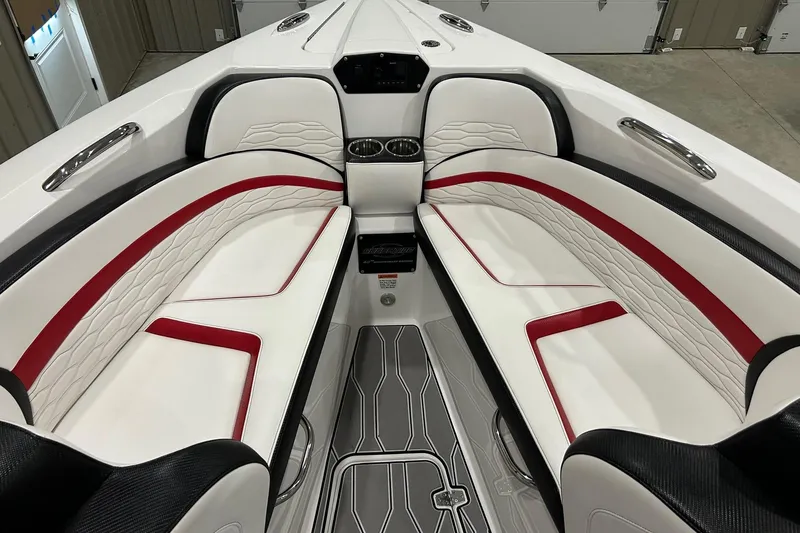 Slide: The Image of 2023 Sunsation 32 CCX boat interior with white and red seating, modern design. - 9