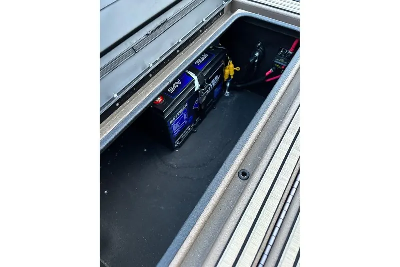 Slide: The Image of Battery compartment of 2025 Thor Lake Hammer boat, showcasing electrical setup. - 13