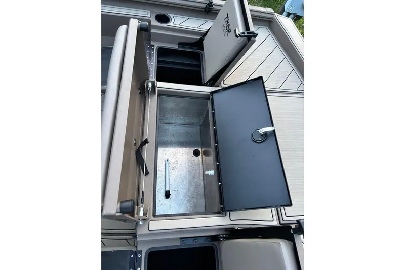 Slide: The Image of Open storage compartments on 2025 Thor Lake Hammer boat deck. - 14