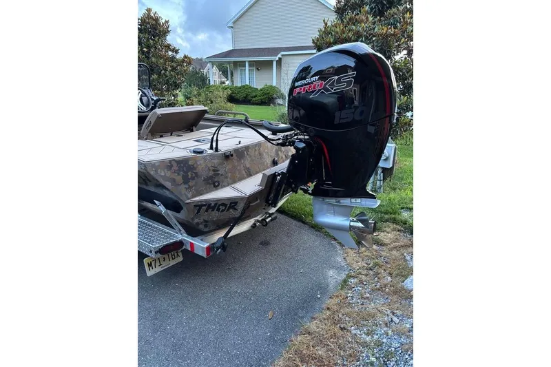 Slide: The Image of 2025 Thor Lake Hammer boat with Mercury Pro XS 150 outboard motor. - 2