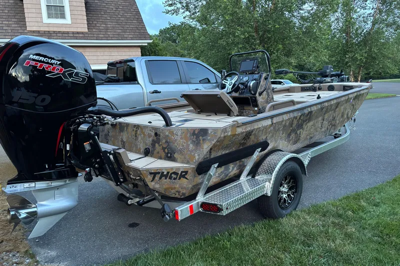 Slide: The Image of 2025 Thor Lake Hammer boat with Mercury Pro XS engine on trailer. - 3