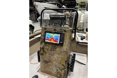 Slide: The Image of 2025 Thor Lake Hammer boat console with fish finder and camouflage design. - 6