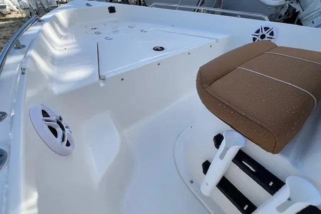 Slide: The Image of 2026 Key West 1720 Center Console boat interior with seating and speakers. - 6