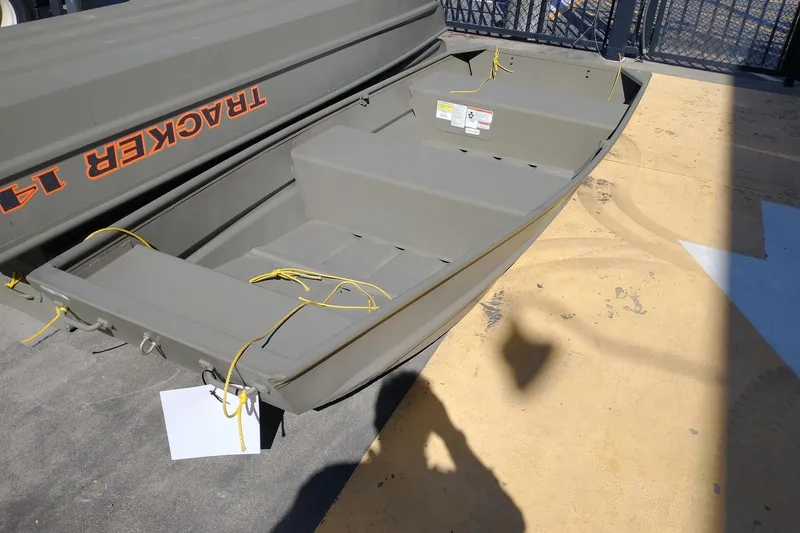 Slide: The Image of 2026 Tracker Grizzly 12 Jon boat on display, featuring durable design and yellow ropes. - 6