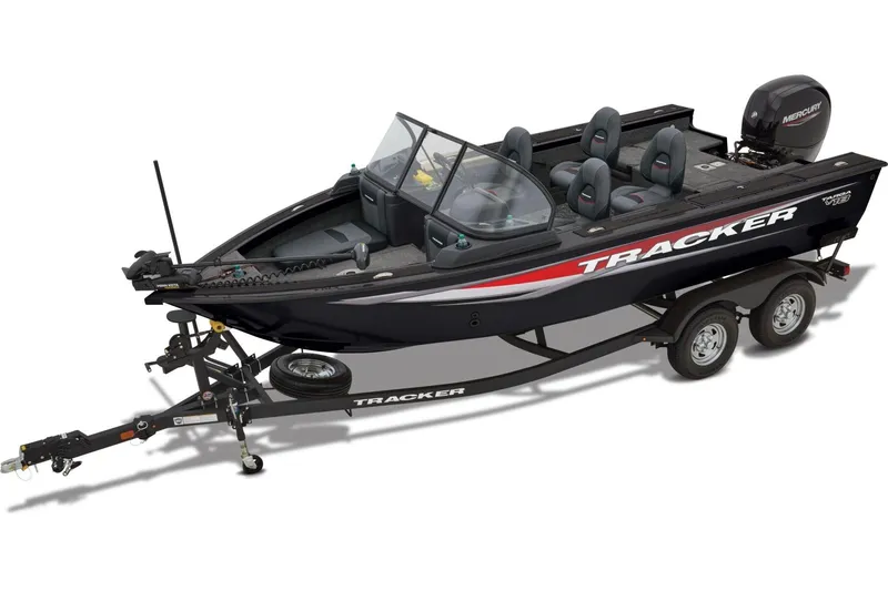 Slide: The Image of 2026 Tracker Targa V-18 Combo boat interior with seating and windshield under a cloudy sky. - 3