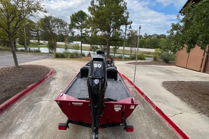Slide: The Image of 2026 Tracker Bass Tracker Classic XL boat parked near a scenic outdoor area. - 2