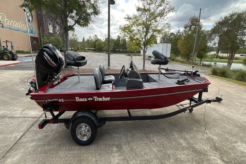 Slide: The Image of 2026 Tracker Bass Tracker Classic XL boat on trailer, parked outdoors. - 4