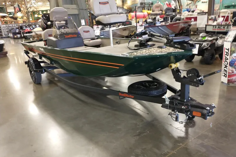 Slide: The Image of 2026 Tracker Bass Tracker Classic Limited boat on display in showroom. - 2