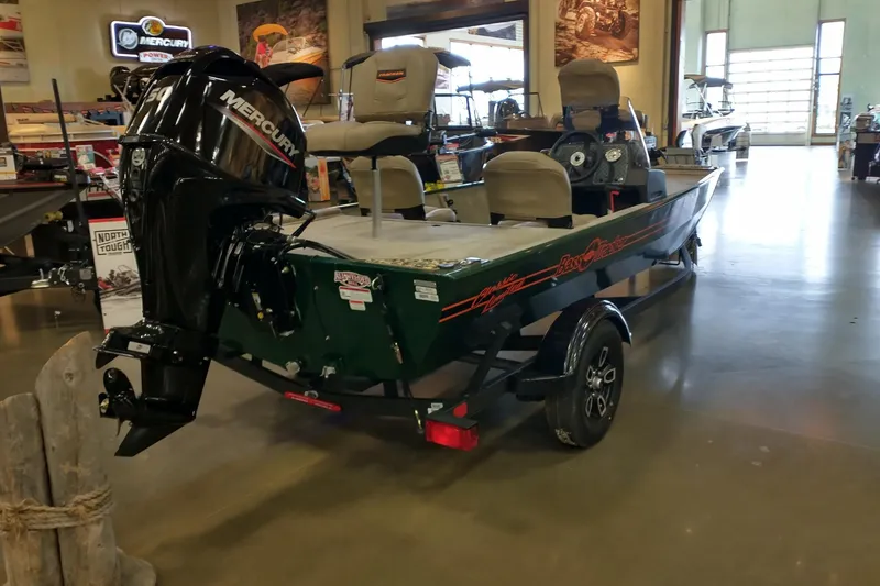 Slide: The Image of 2026 Tracker Bass Tracker Classic Limited boat with Mercury engine in showroom. - 3