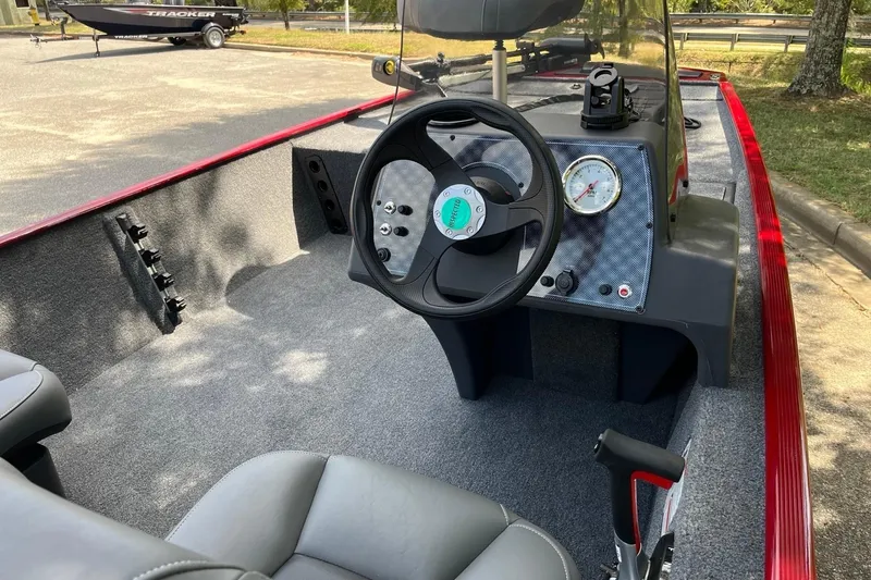 Slide: The Image of 2026 Tracker Bass Tracker Classic XL boat interior with steering wheel and dashboard. - 5