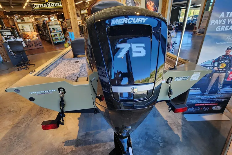 Slide: The Image of Tracker Pro Team 175 Crappie Edition 2026 with Mercury 75 engine in showroom. - 5