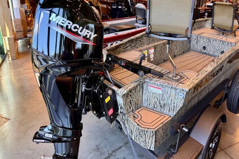 Slide: The Image of 2026 Tracker Grizzly 1650 T Prairie Wings Edition boat with Mercury outboard motor. - 2