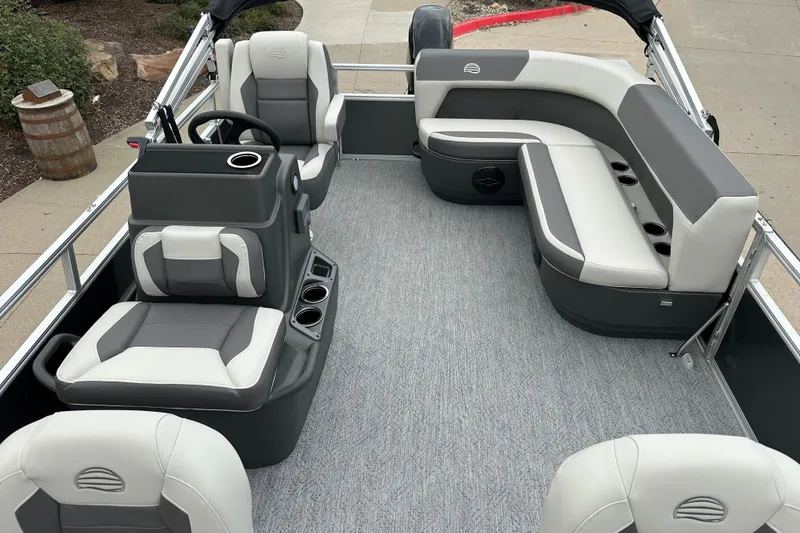 Slide: The Image of 2026 Sun Tracker Bass Buggy 16 XL Select pontoon boat interior with gray and white seating. - 6