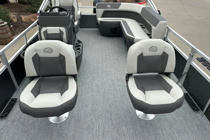 Slide: The Image of 2026 Sun Tracker Bass Buggy 16 XL Select pontoon boat interior with gray and white seating. - 7