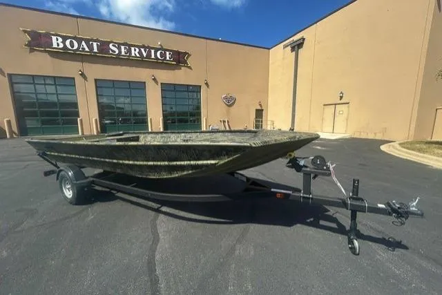 The Image of 2026 Tracker Grizzly 1754 Utility boat on trailer outside boat service center. - 0