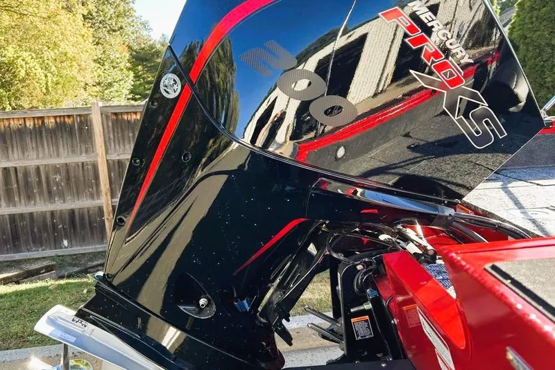 Slide: The Image of 2026 Tracker Targa V-19 Combo with Mercury Pro XS engine, outdoors. - 2