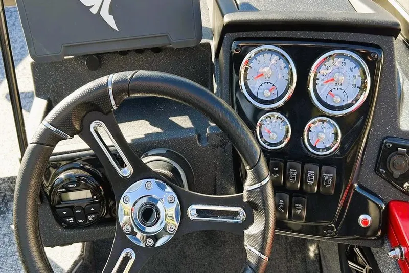 Slide: The Image of 2026 Tracker Targa V-19 Combo dashboard with steering wheel and instrument gauges. - 3