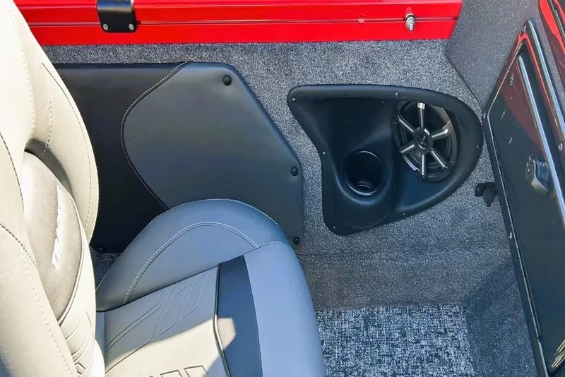 Slide: The Image of 2026 Tracker Targa V-19 Combo interior with speaker and gray seating. - 6