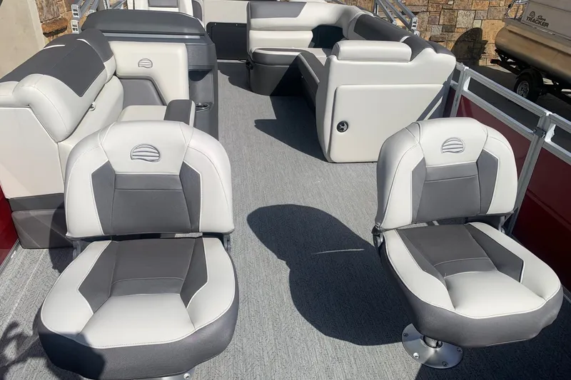 Slide: The Image of 2026 Sun Tracker Fishin' Barge 22 DLX interior with comfortable seating and modern design. - 6