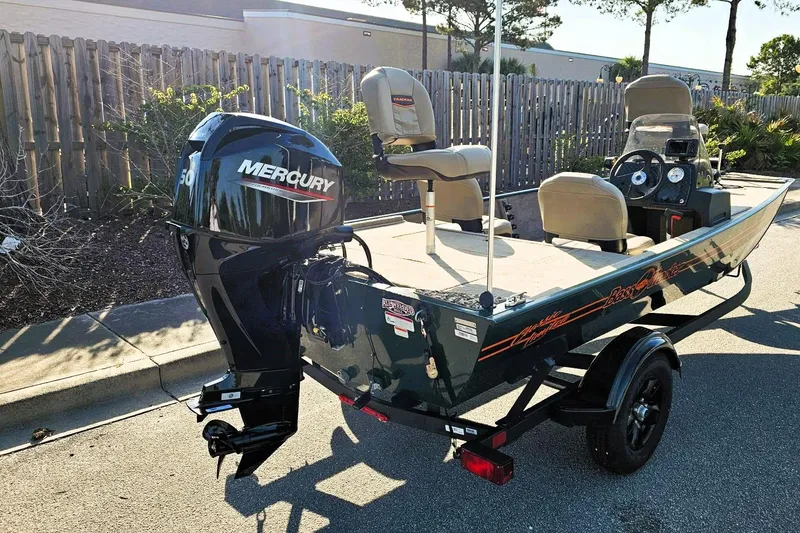 Slide: The Image of 2026 Tracker Bass Tracker Classic Limited boat with Mercury engine on trailer. - 2