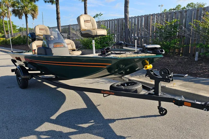Slide: The Image of 2026 Tracker Bass Tracker Classic Limited boat on trailer, parked outdoors. - 4