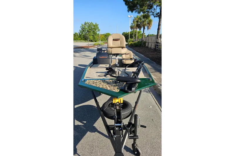 Slide: The Image of 2026 Tracker Bass Tracker Classic Limited boat on trailer in sunny outdoor setting. - 5