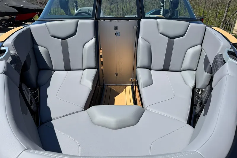Slide: The Image of 2025 MasterCraft XT23 boat interior with gray seating and modern design. - 7