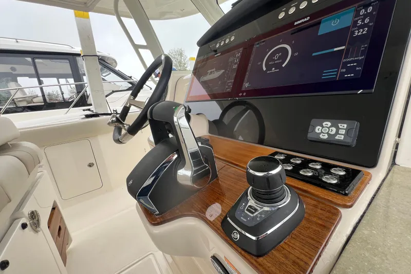Slide: The Image of Control panel of 2026 Boston Whaler 350 Realm with advanced navigation system. - 15