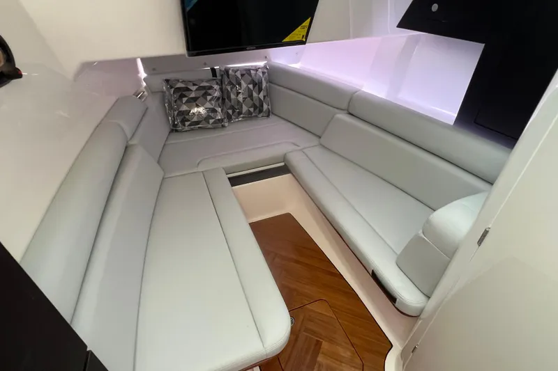 Slide: The Image of Interior of 2026 Boston Whaler 350 Realm, featuring sleek seating and modern design. - 16