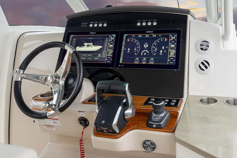 Slide: The Image of Manufacturer Provided Image: 2026 Boston Whaler 350 Realm helm with advanced navigation displays and controls. - 5