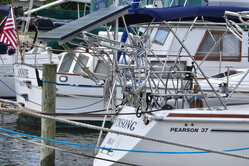 Slide: The Image of Pearson 37-2 sailboat from 1989 docked in a marina with solar panel. - 1