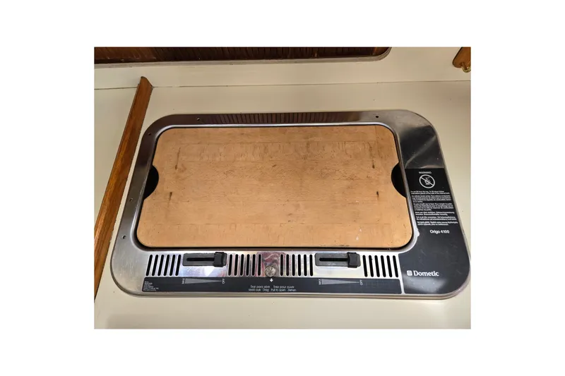 Slide: The Image of Dometic Origo 4100 stove with wooden cover on a 1989 Pearson 37-2 yacht. - 27