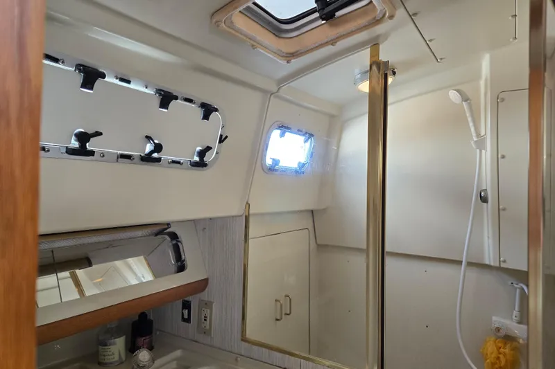 Slide: The Image of Interior of 1989 Pearson 37-2 yacht bathroom with shower and porthole. - 35