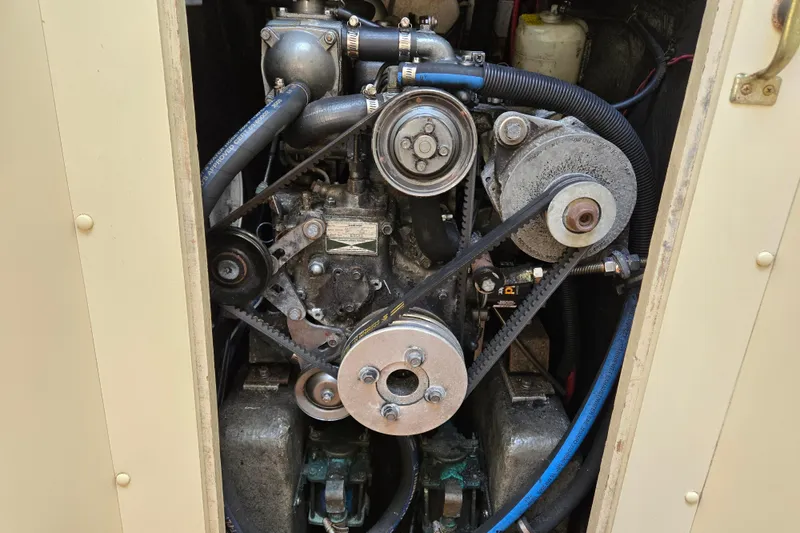 Slide: The Image of Engine compartment of a 1989 Pearson 37-2 sailboat, showcasing belts and pulleys. - 38