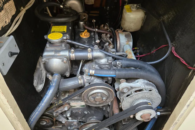 Slide: The Image of Engine compartment of a 1989 Pearson 37-2 sailboat, showing detailed mechanical components. - 39