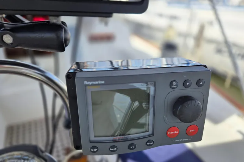 Slide: The Image of Raymarine autopilot control on 1989 Pearson 37-2 sailboat, featuring display and navigation buttons. - 9