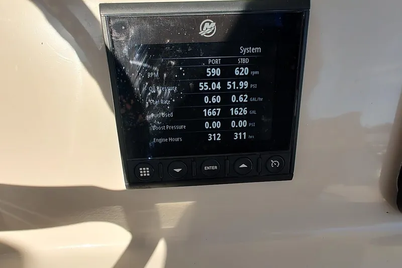 Slide: The Image of Display screen on 2019 Boston Whaler 330 Outrage showing engine metrics and system data. - 18