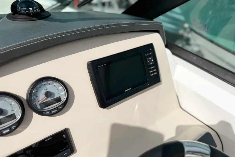 Slide: The Image of Dashboard of 2015 Boston Whaler 230 Vantage with Garmin display and gauges. - 11
