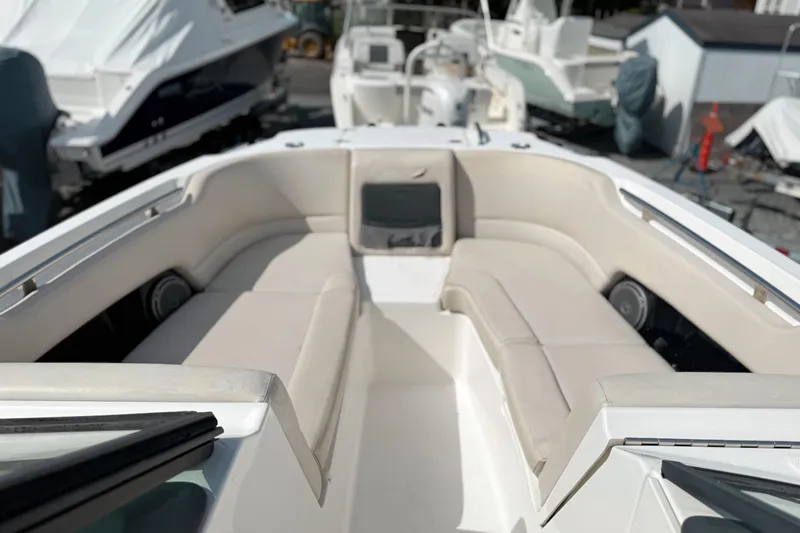 Slide: The Image of 2015 Boston Whaler 230 Vantage boat interior with beige seating and sleek design. - 15