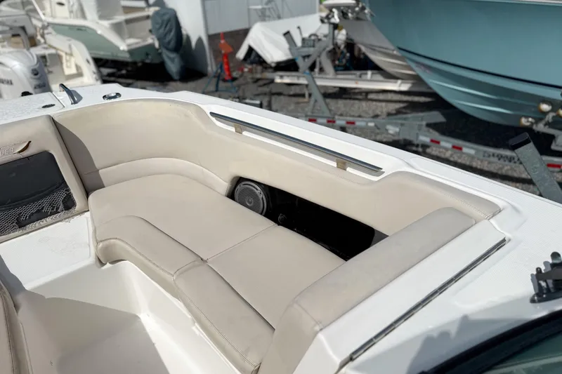 Slide: The Image of 2015 Boston Whaler 230 Vantage boat interior with beige seating and speaker. - 17