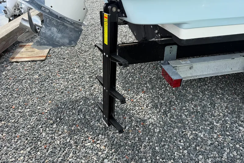 Slide: The Image of Rear view of 2015 Boston Whaler 230 Vantage with ladder and outboard motor. - 20