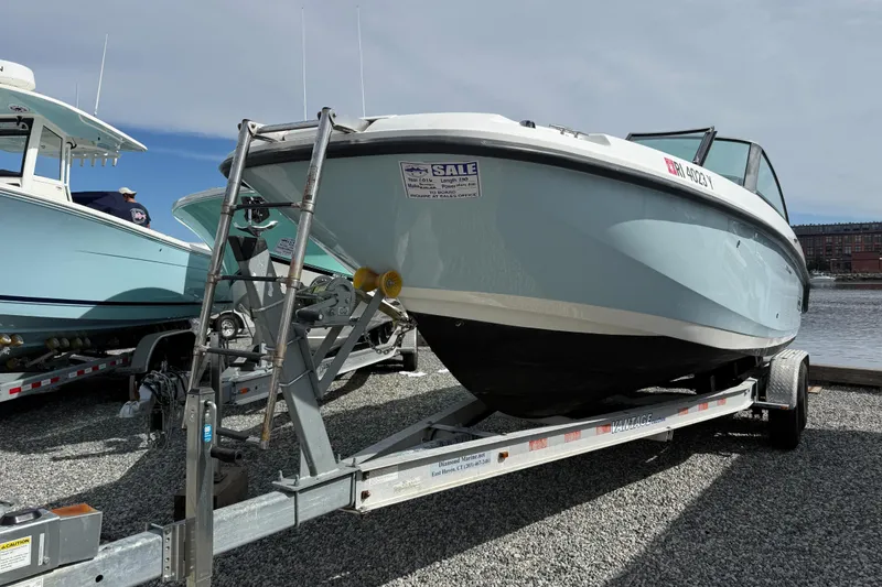 Slide: The Image of 2015 Boston Whaler 230 Vantage boat on trailer, displayed for sale. - 21