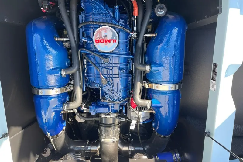 Slide: The Image of 2025 MasterCraft NXT22 engine with blue components and Ilmor branding. - 17