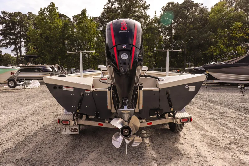 Slide: The Image of 2022 Ranger RB200 boat on trailer with outboard motor, parked in a lot. - 5