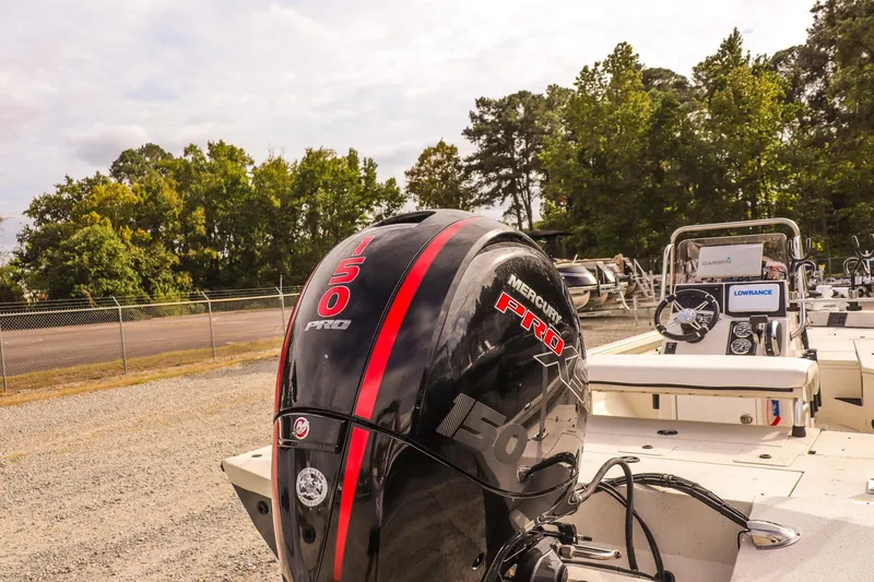 Slide: The Image of 2022 Ranger RB200 boat with Mercury 150 Pro motor, parked outdoors. - 8