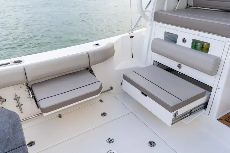 Slide: The Image of Manufacturer Provided Image: 2026 Boston Whaler 365 Conquest boat cruising on water with fishing gear and passengers. - 10