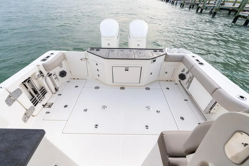 Slide: The Image of Manufacturer Provided Image: 2026 Boston Whaler 365 Conquest boat interior with foldable seating and storage. - 16