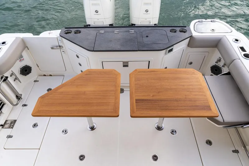 Slide: The Image of Manufacturer Provided Image: Outdoor kitchen on 2026 Boston Whaler 365 Conquest boat with grill and sink. - 17