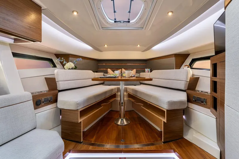 Slide: The Image of Manufacturer Provided Image: Luxurious interior of 2026 Boston Whaler 365 Conquest with elegant seating and dining area. - 26