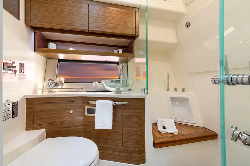 Slide: The Image of Manufacturer Provided Image: Luxurious bathroom in 2026 Boston Whaler 365 Conquest yacht, featuring modern fixtures and wood accents. - 30